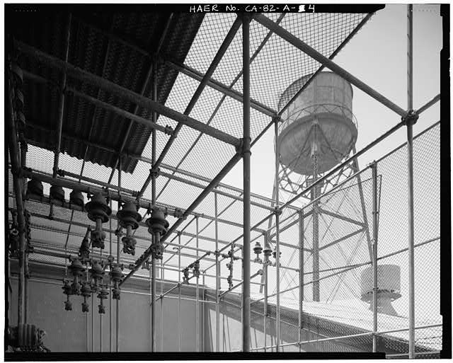 Ford Long Beach Assembly Plant VIEW OF WATER TOWER FROM ELECTRICAL TRANSFORMER CAGE AT NORTH END OF SECOND FLOOR WAREHOUSE. VIEW TO WEST-NORTHWEST. 