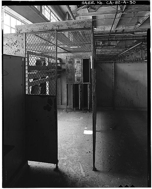 Ford Long Beach Assembly Plant LOCKER CAGE, CHANGE AREA, TOILETS ABOVE ROOF PANEL STORAGE AREA. VIEW TO SOUTH. 